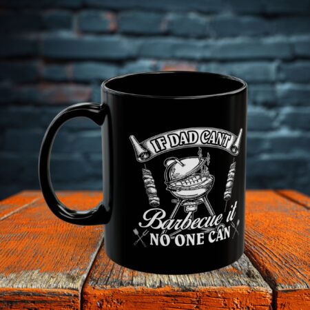 Black ceramic coffee mug with a white graphic featuring a barbecue grill and the text "If Dad Can't Barbecue It No One Can".