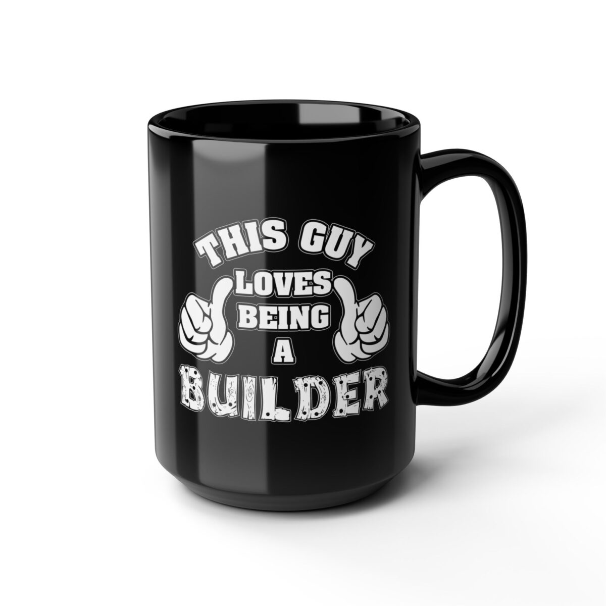 A black coffee mug with white text and graphics that read "THIS GUY LOVES BEING A BUILDER".