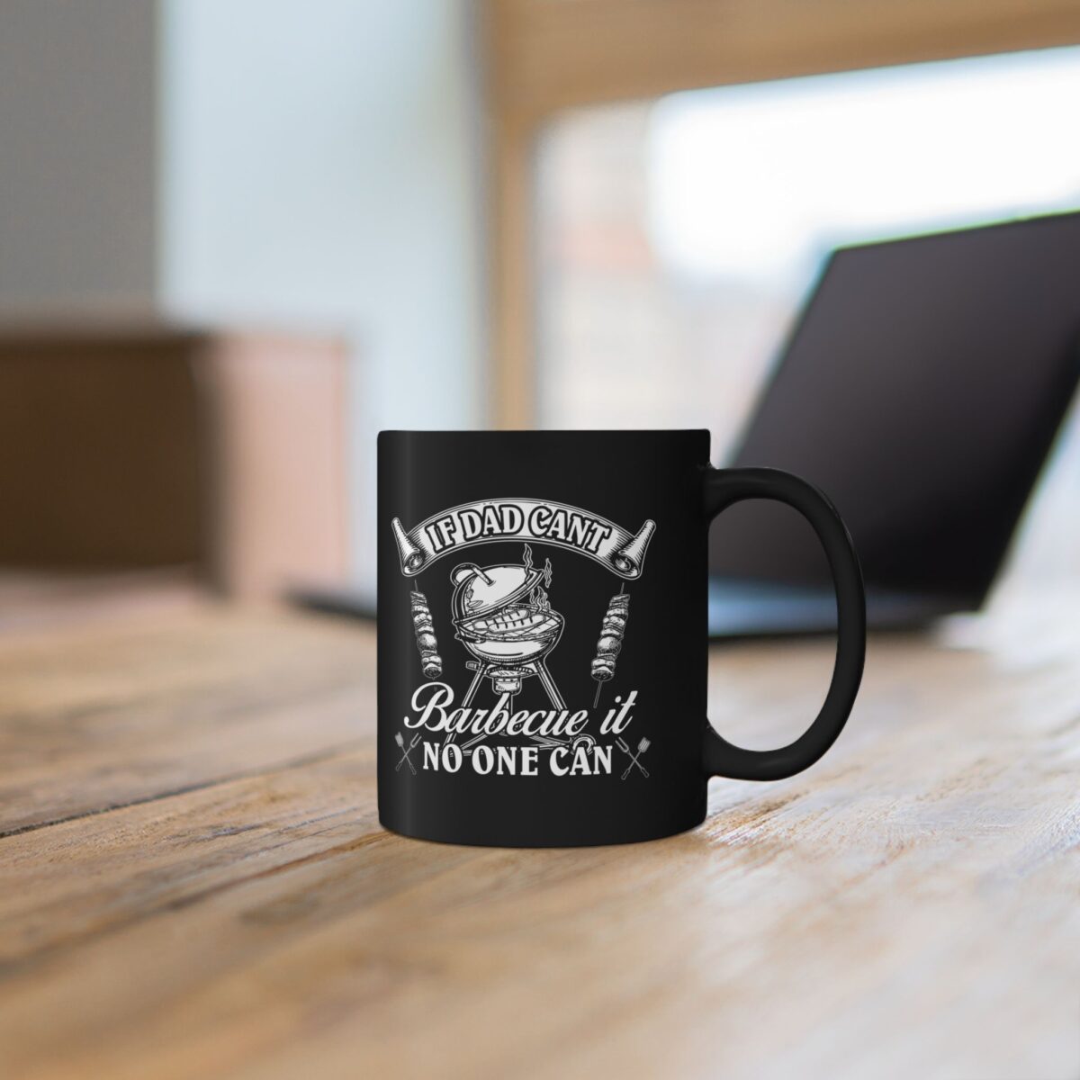 Black ceramic mug with white text and graphic of a barbecue grill.