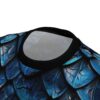Deep blue and black dragon scales cover this all over print apparel, with textured, iridescent highlights suggesting metallic armor.