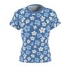 Blue and white flowers cover this seamless pattern tee, scattered across a solid blue background with a textured appearance.