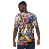 Vivid pink, purple, and white daisies, with blue accents, surround a tiger-striped cat with striking green eyes on this all-over print shirt.