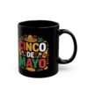 A black mug features a festive