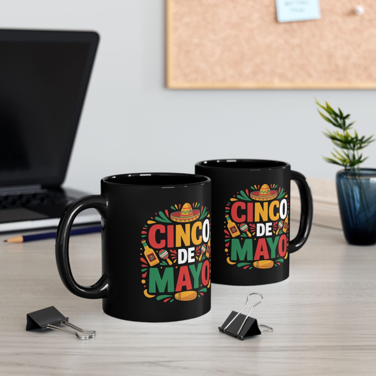 Black mug featuring a vibrant 'Cinco De Mayo' design with a sombrero, maracas, and festive splashes of color.