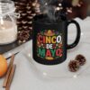 A black mug features