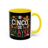 A black mug with a yellow interior and handle, featuring a vibrant Cinco De Mayo design with Mexican flag, sombrero, maracas, and bottles.
