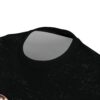 Black fabric with a distressed, textured pattern. Detailed stitching around the collar.
