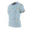 White and yellow stripes crisscross a blue background, adorned with smiling cat faces and small daisy flowers, covering this sublimation graphic tee.