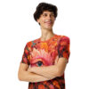 Fiery reds, oranges, and yellows cover this sublimation graphic tee, depicting a surreal eye surrounded by lush foliage and a small bird.