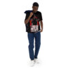 Red splatter patterns and a distressed white star cover this black tee shirt, featuring a silhouette and bold white text.