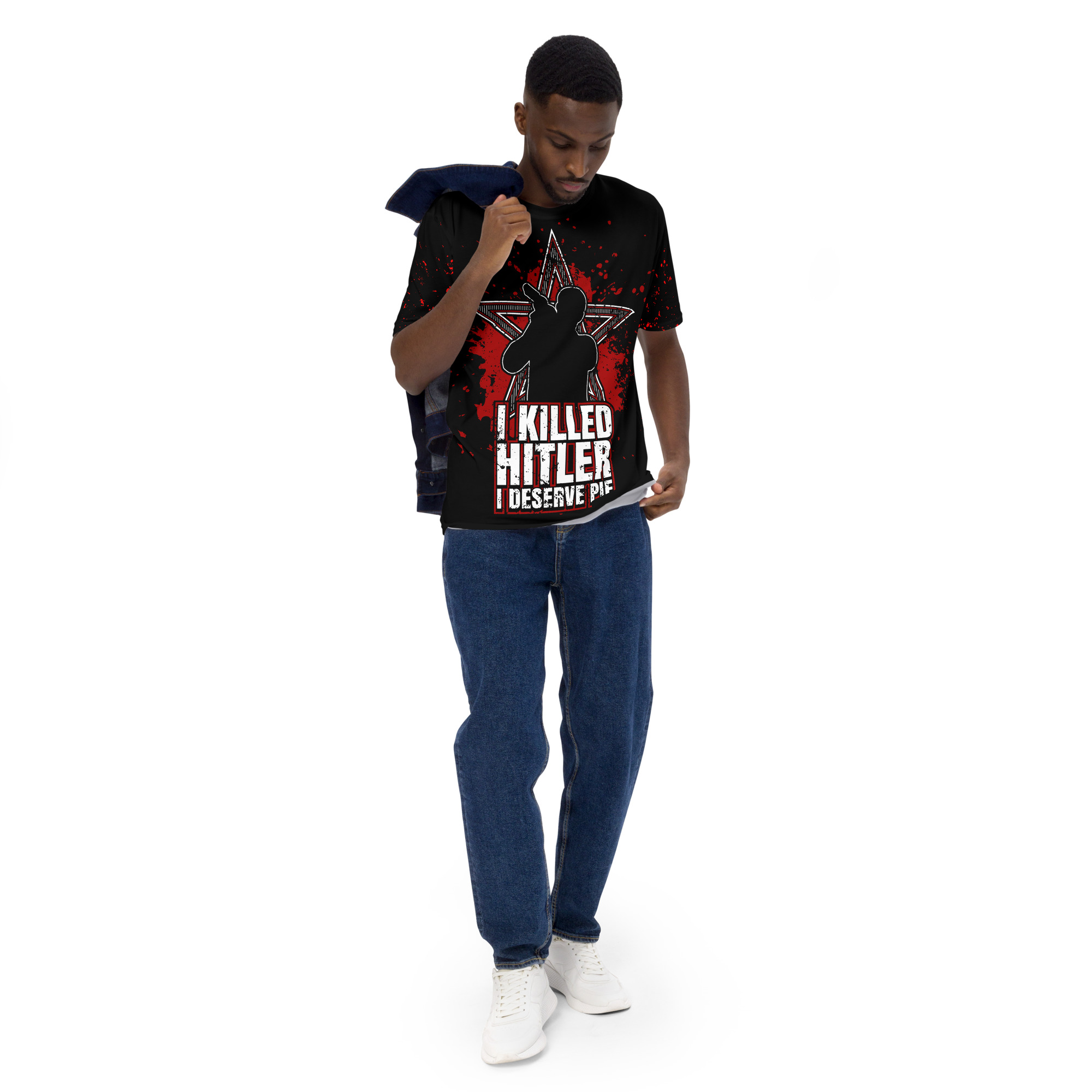 Red splatter patterns and a distressed white star cover this black tee shirt, featuring a silhouette and bold white text.