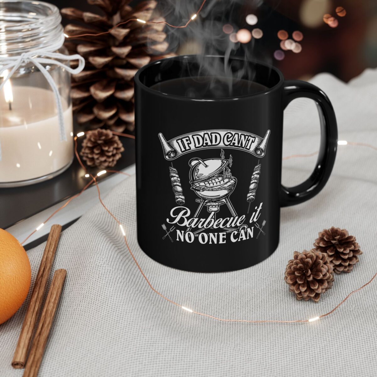 Black coffee mug with white text and graphics about barbecuing.