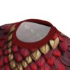 Rich red and metallic gold feather motifs cover this all over print apparel, creating a textured, layered effect with intricate vein details on each element.