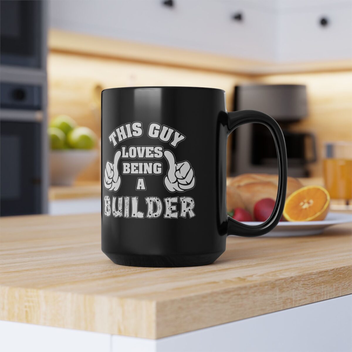 Black coffee mug with white text and graphics that say "THIS GUY LOVES BEING A BUILDER".