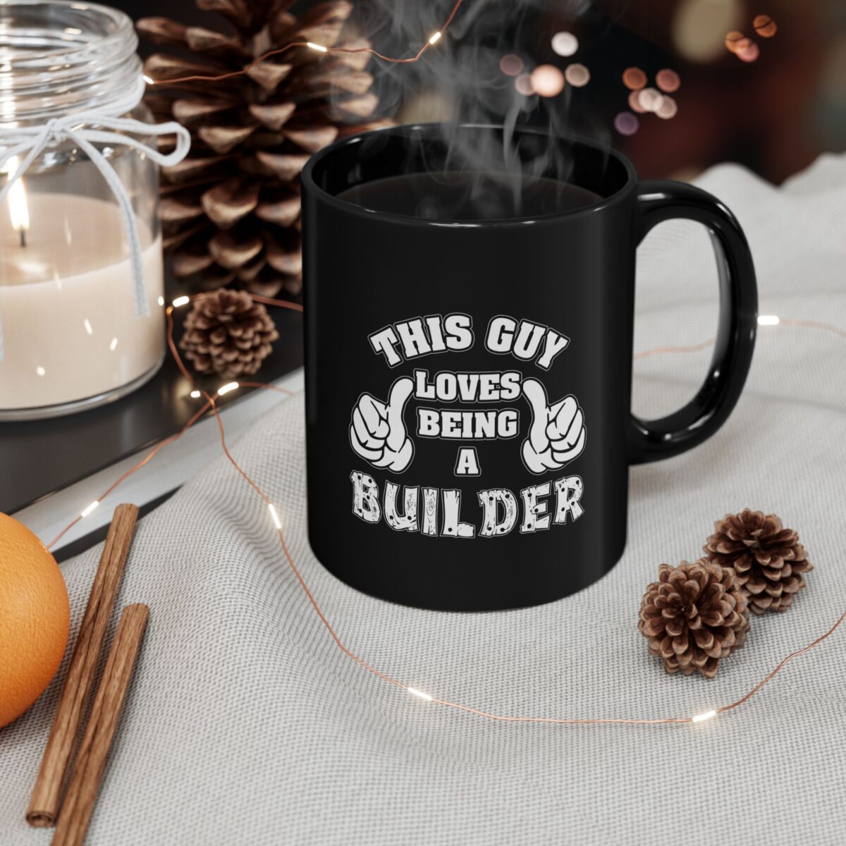 A black ceramic coffee mug with "THIS GUY LOVES BEING A BUILDER" printed in white text and graphics.