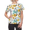 White all over print sublimation tee with a fun doodle pattern of cats, yellow and teal abstract shapes, and black accents.