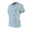 Light blue t-shirt with a seamless all over print of cute cat faces and daisies on vertical white and yellow stripes.