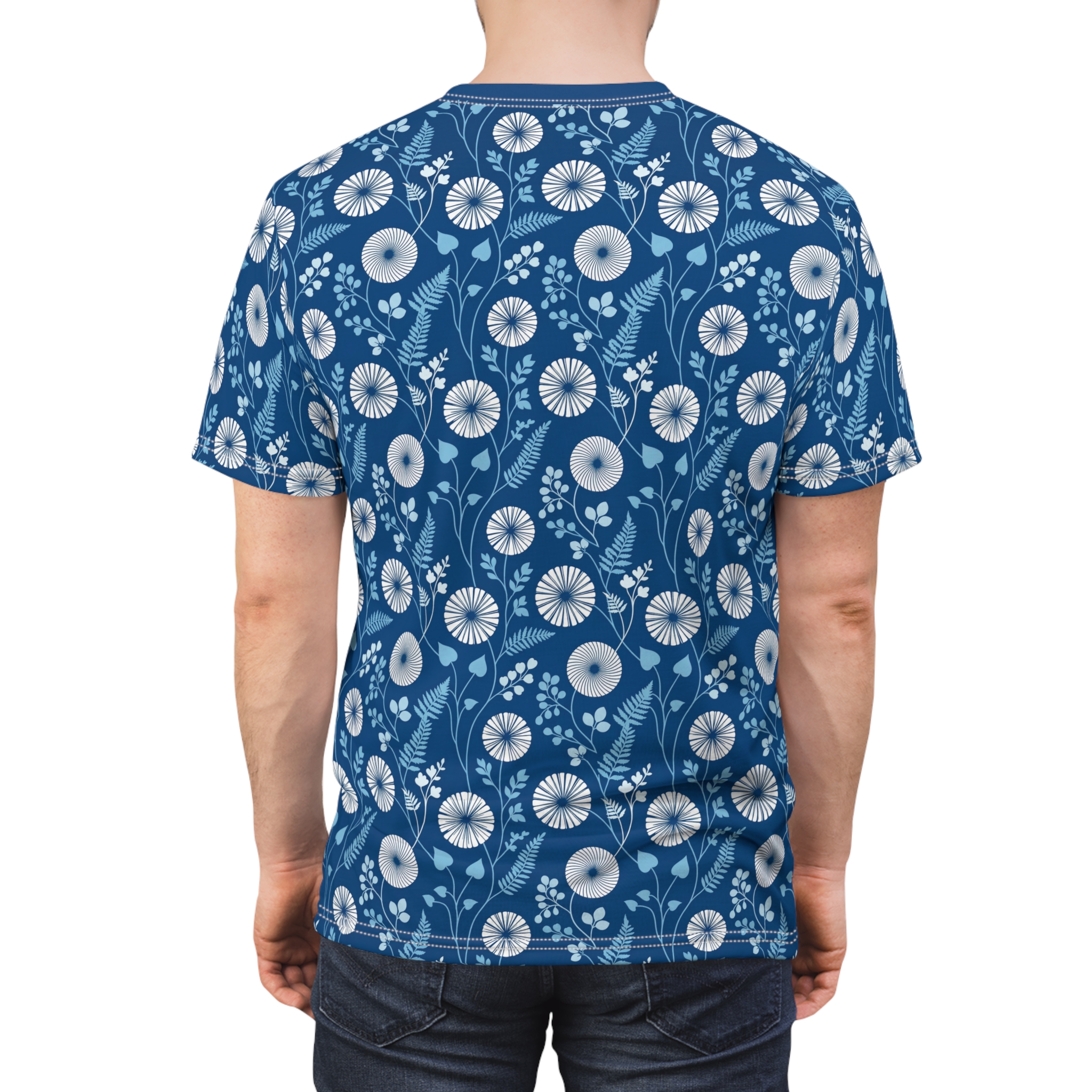 Deep blue background with white and light blue floral and leaf patterns across this all over print t-shirt.
