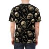 Realistic skulls and bones scattered on a black all over print t-shirt.