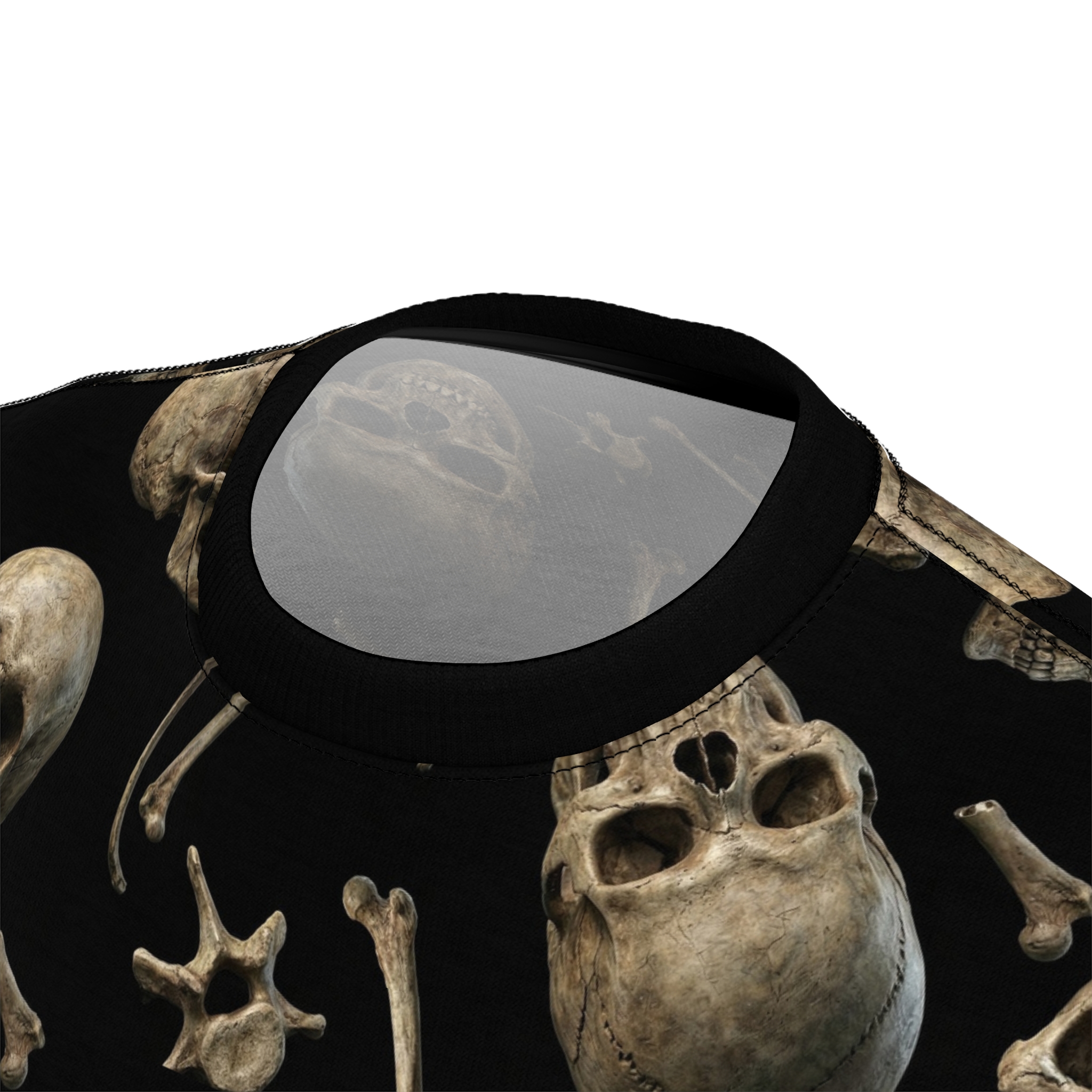 Sepia-toned skulls and bones are scattered across this all over print t-shirt on a black background.