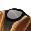 Close-up of fluffy golden-brown fur texture covering this all over print t-shirt.
