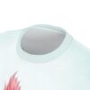 Soft pink fish swim across this light blue all over print t-shirt.