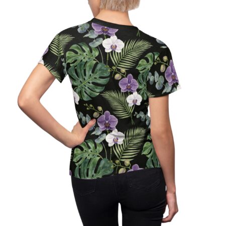 All over print sublimation tee featuring tropical monstera leaves and orchids in purple and white.