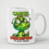 White ceramic mug with a cartoon green dinosaur wearing glasses and the text 