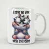 White ceramic mug with a cartoon hippo wearing glasses and text.