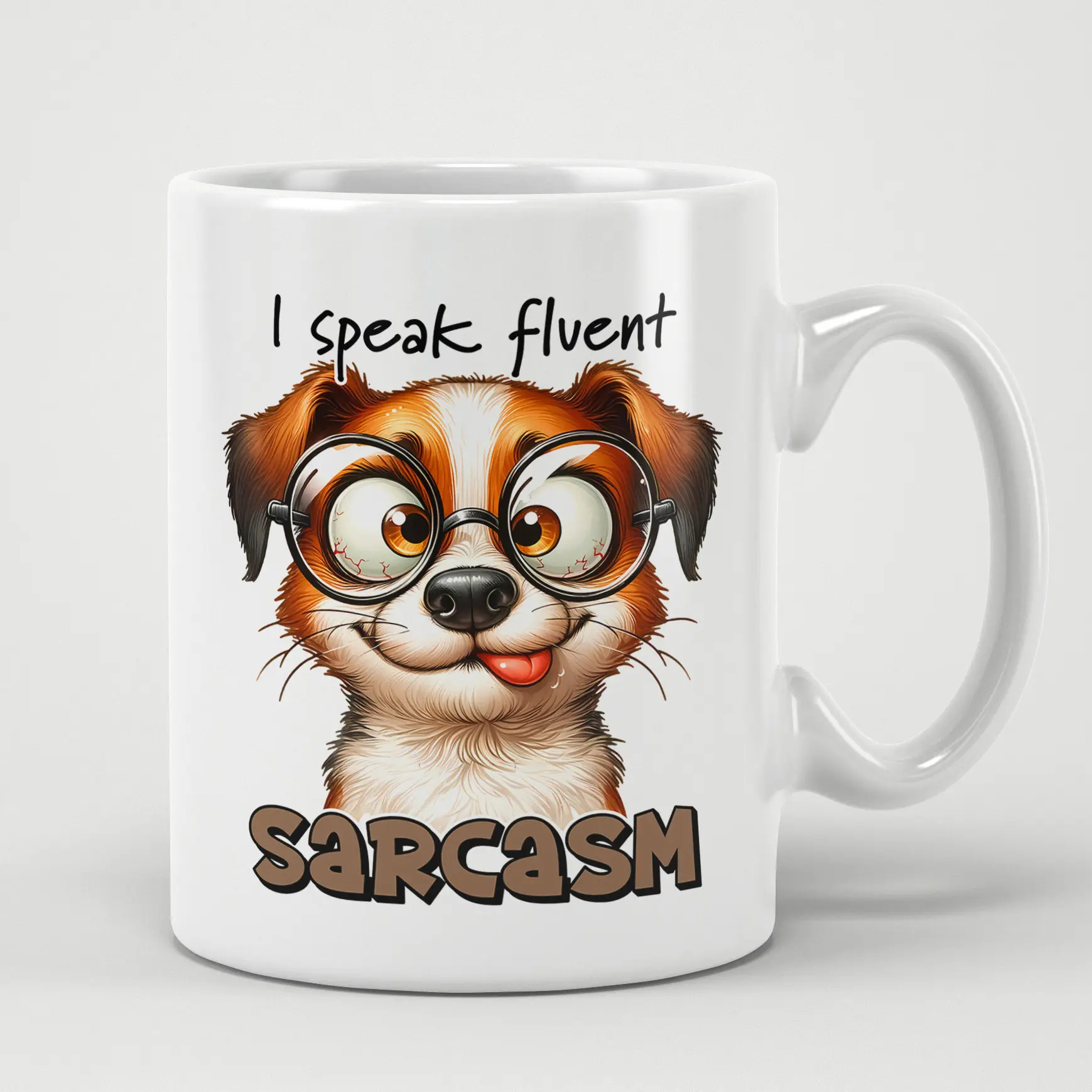 A white ceramic mug with a funny cartoon dog wearing glasses and sticking out its tongue.