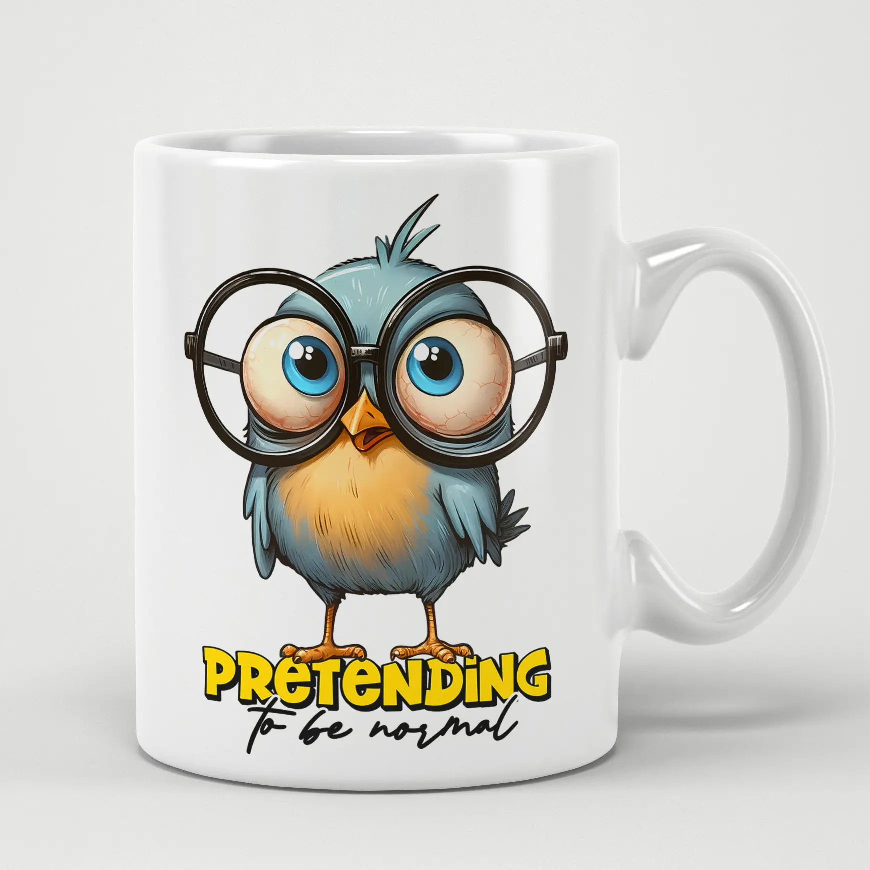 White ceramic mug with a blue bird wearing large glasses and the text "Pretending to be normal".