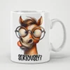 White mug with a cartoon horse wearing round glasses and sticking its tongue out, with 
