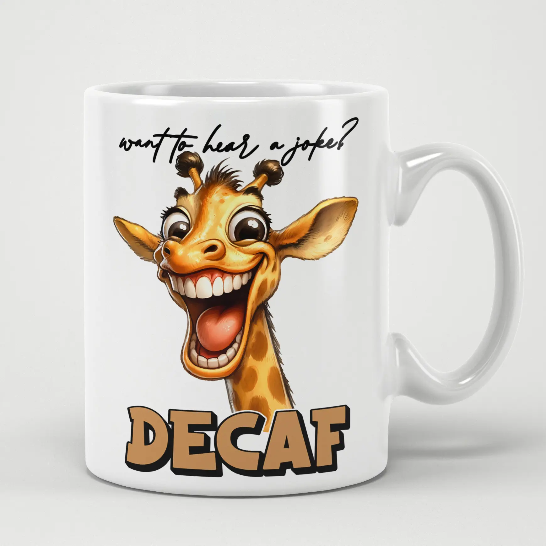A white mug with a cartoon giraffe saying "Want to hear a joke?" and "DECAF" in large brown letters.