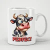 White ceramic mug with a cartoon cow wearing glasses and the text 