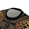 Black fabric with intricate gold knotwork and Norse runes, an all over print t-shirt.
