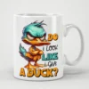 White mug with a cartoon duck graphic that says 