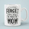 White ceramic coffee mug with bold black lettering that reads 
