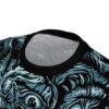 Creepy multi-eye skulls swarm across this garment in a vibrant all-over print that covers every inch of the fabric from the collar down.