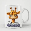 White ceramic mug with a cartoon giraffe looking tired and grumpy, with text that reads 