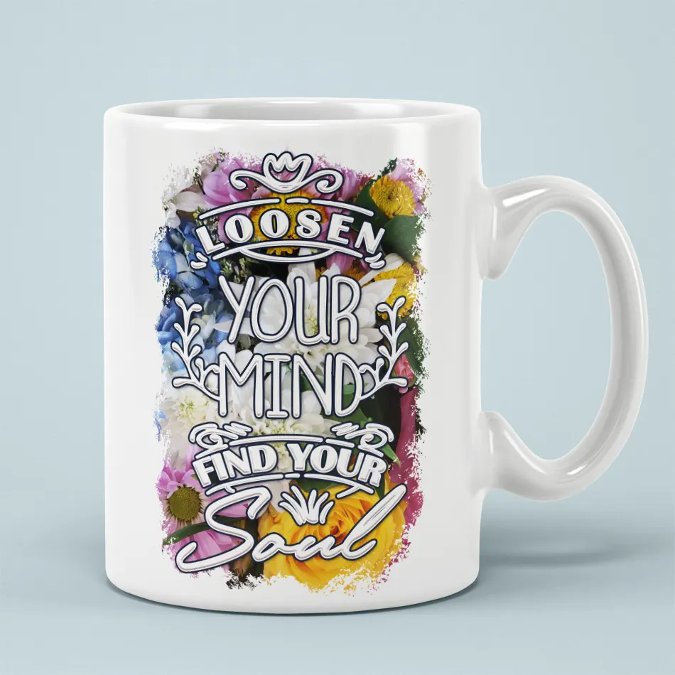 White ceramic mug with a vibrant floral design and inspirational text.