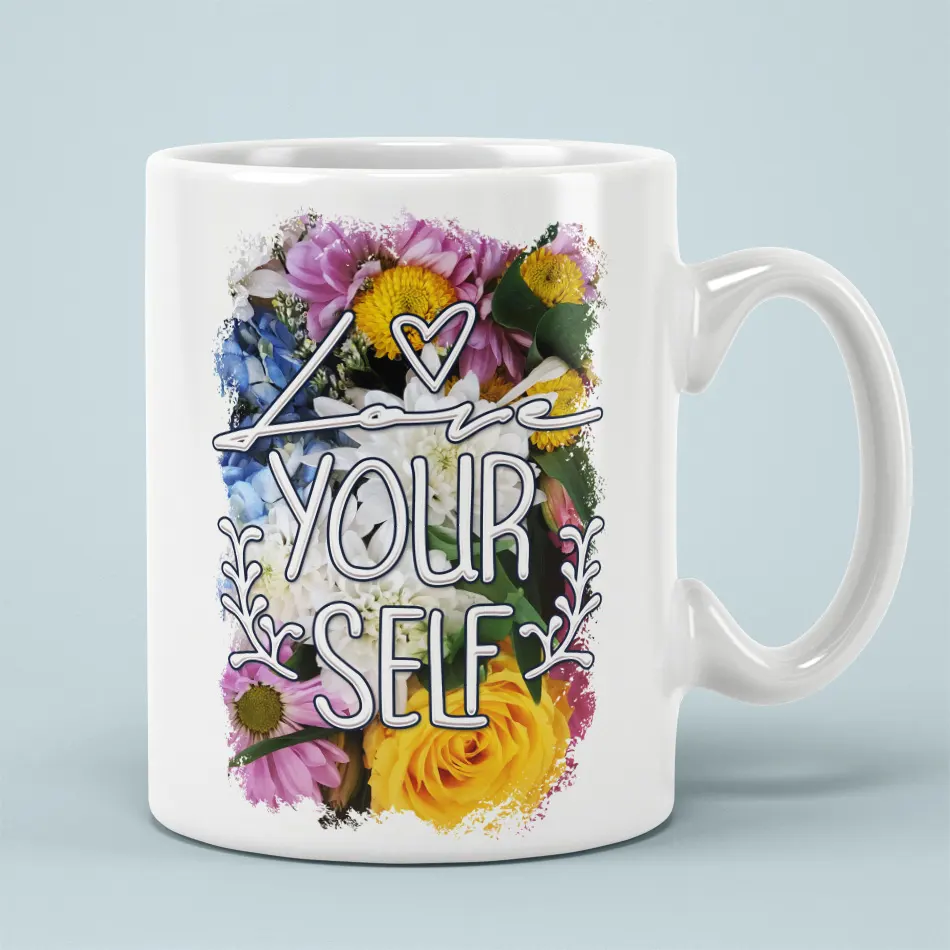 White ceramic mug with vibrant floral art and "Love Your Self" text.