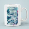White ceramic mug with a vibrant floral design and inspirational text.