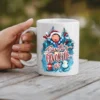 White ceramic mug with a festive Christmas design featuring a boy, snowman, and ornaments.