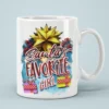 White ceramic mug with a festive Christmas design featuring a golden star, red berries, string lights, and presents.