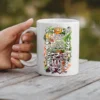 White ceramic coffee mug with a floral design and text reading 'Worry Less Yoga More'.