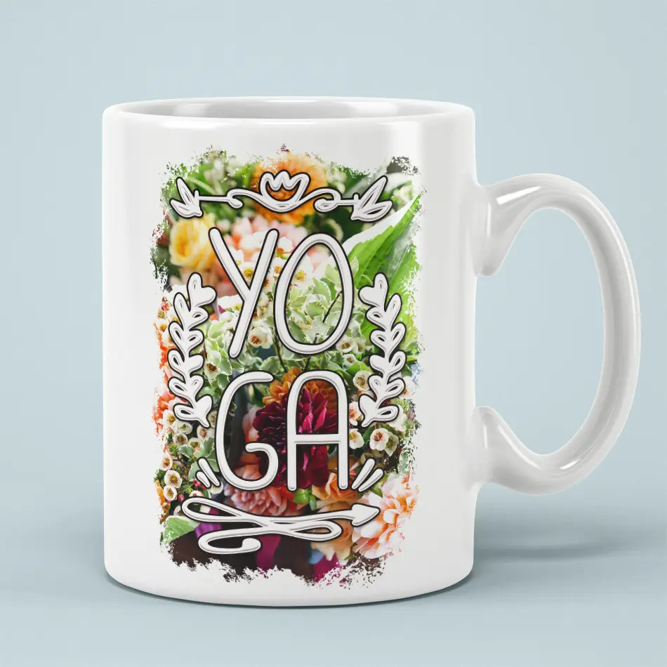 White ceramic mug with a vibrant floral design and the word "YOGA" in bold white lettering.