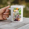 White ceramic mug with a vibrant floral design and