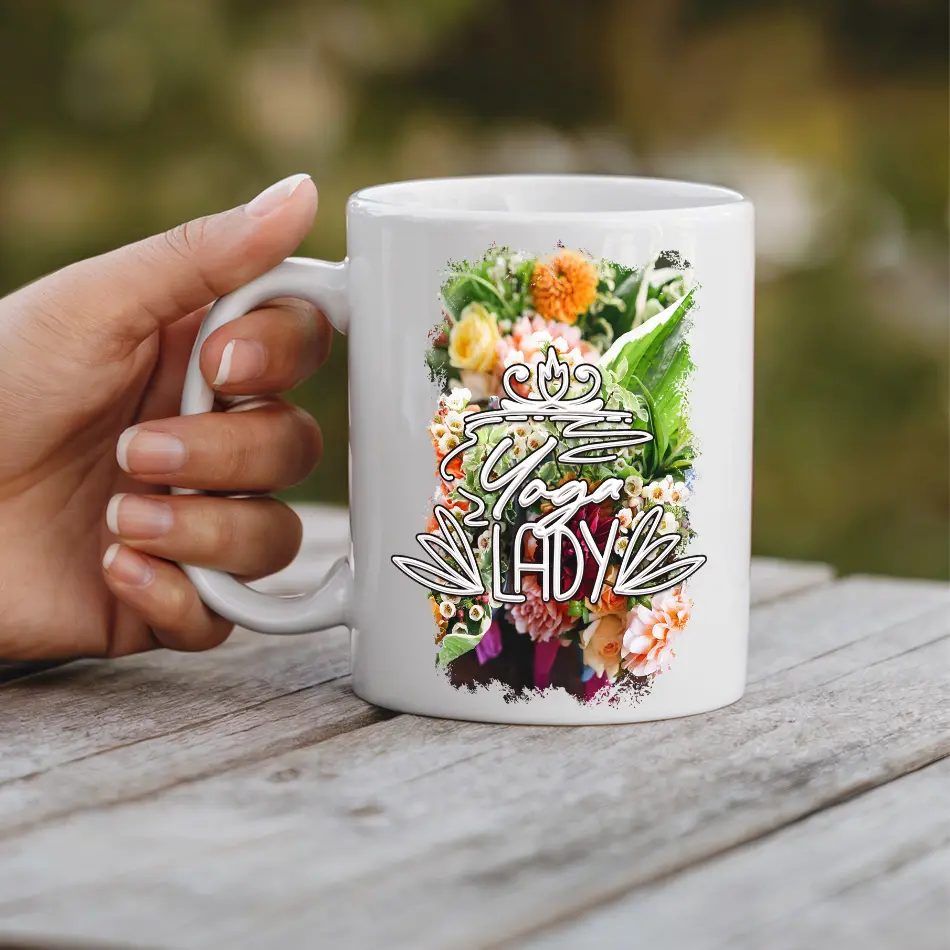 White ceramic mug with a vibrant floral design and "Yoga Lady" text.