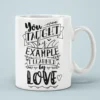 White ceramic coffee mug with black lettering that reads 