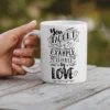 White ceramic coffee mug with black text and hand-drawn graphics.